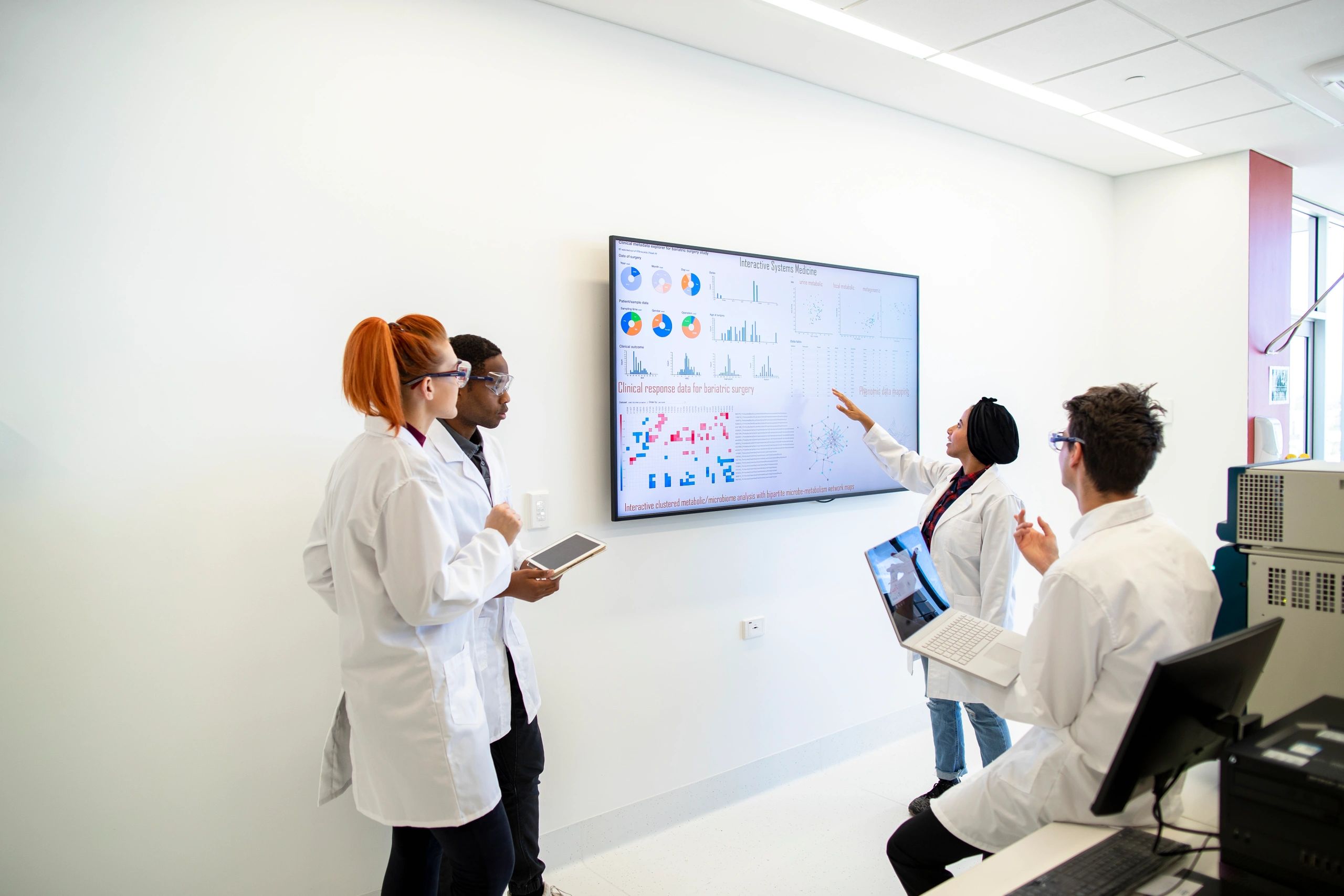 Medical laboratory team reviewing information together