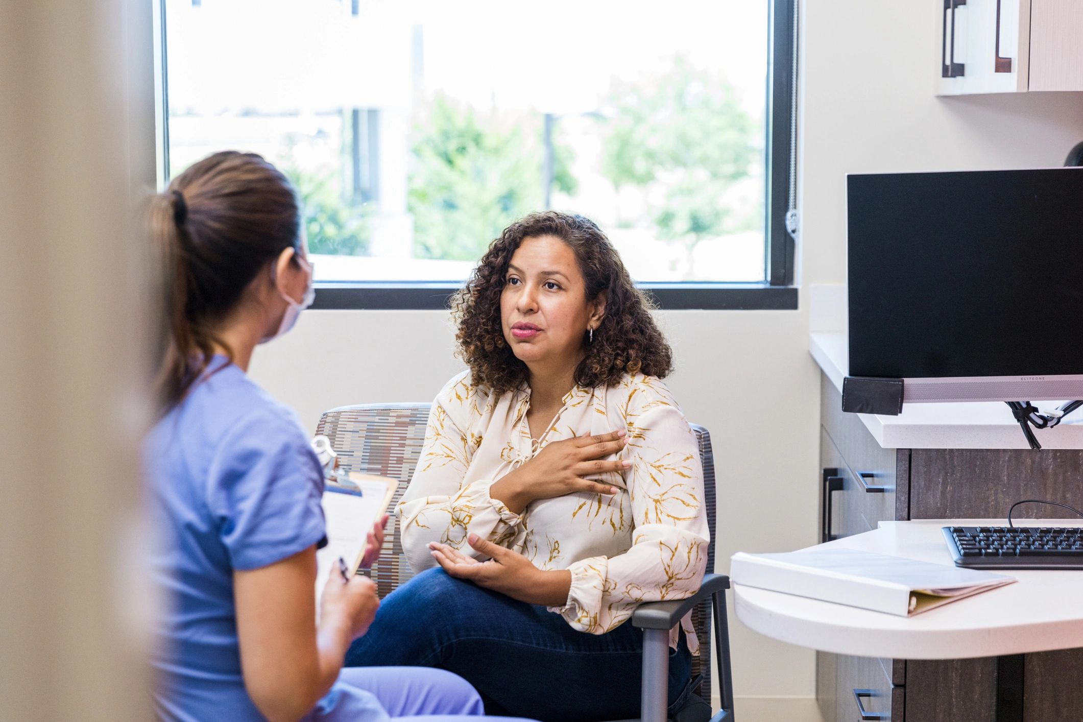 Patient speaking with a healthcare professional during a consultation