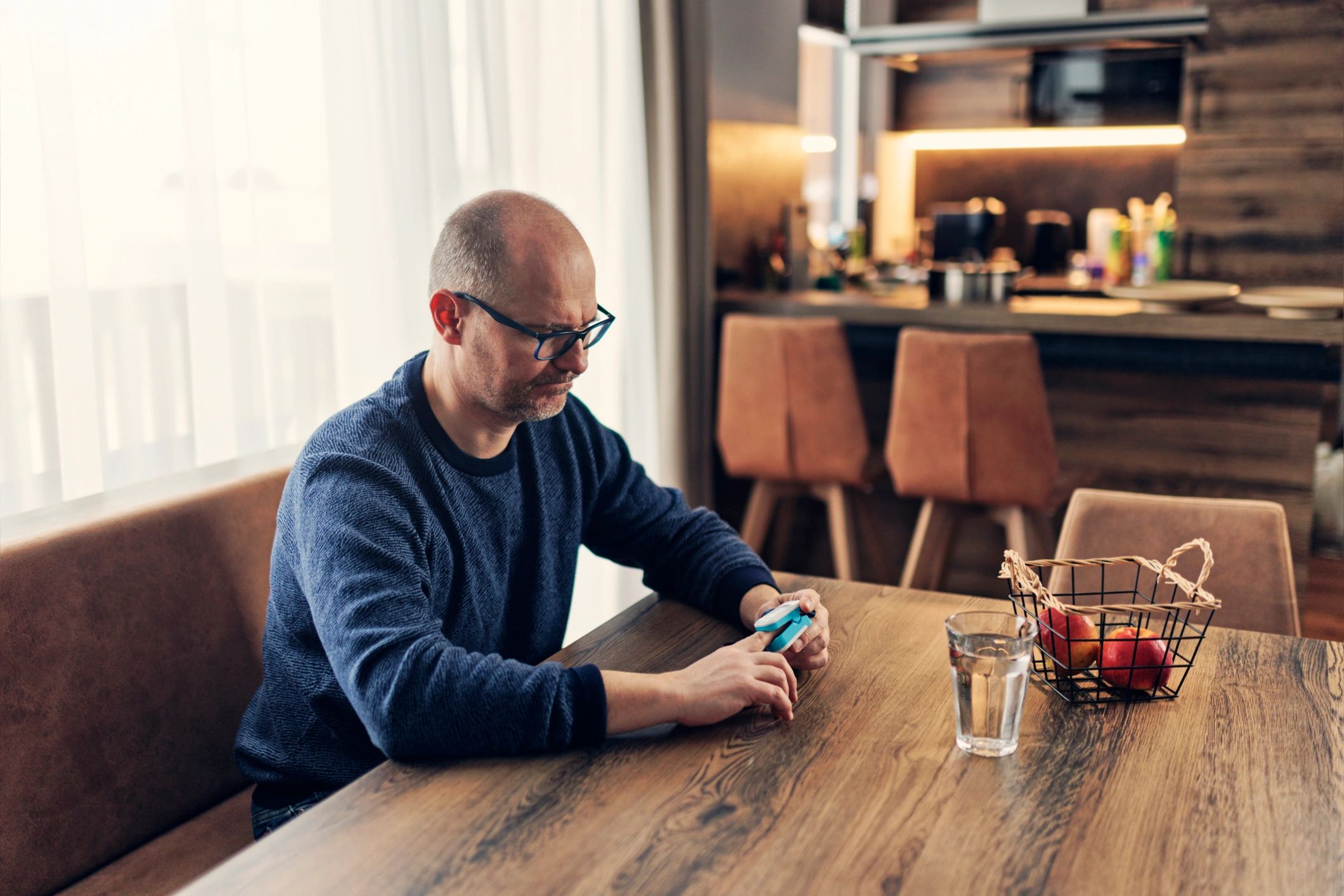 Patient using a home health monitoring device during at-home testing